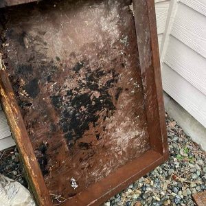 old crawlspace door before rodent exclusion services by Sasquatch pest control