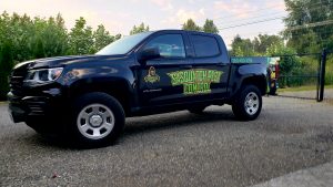 Sasquatch Pest Control service truck parked at a Whatcom County WA job site