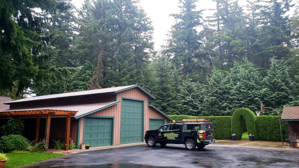 Sasquatch truck in front of barn/garage