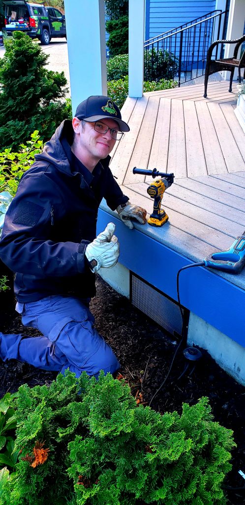 Evan of Sasquatch pest control installing Vent Guards